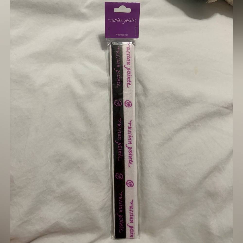 Russian Pointe black and white headbands with purple accents.